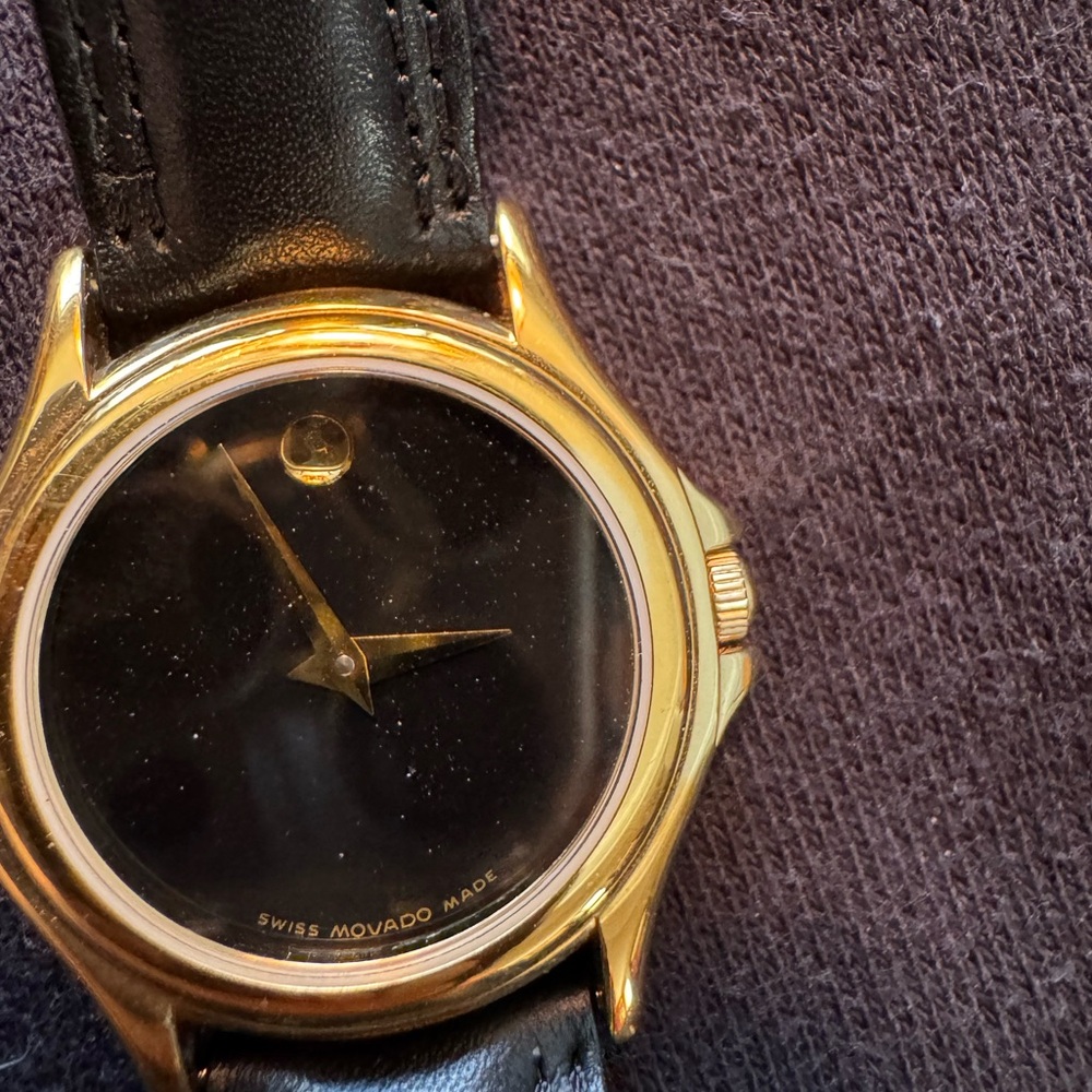 Movado Gold and Black Smartwatch with Elegant Design